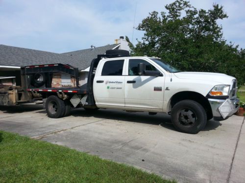 2011 ram 3500 st crew cab pickup dual rear wheels. 4-door 6.7l   9foot flat bed.