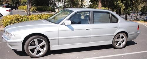 Armored bmw 740il with custom side skirts and bumper