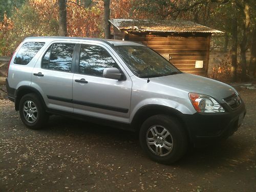 2002 honda cr v, silver, roof rack, privacy glass , sun roof- sliding