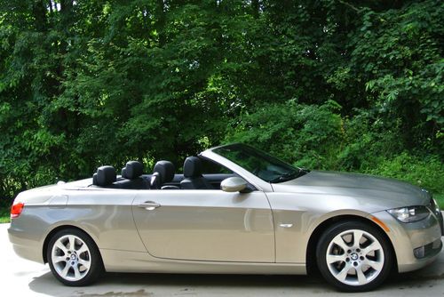 Platinum bronze hard top convertible.  black leather. excellent condition.