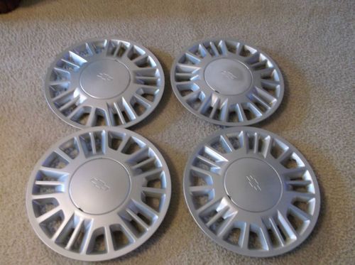 4 used gm 2001 malibu hub caps #sae abs pc  p/n9593496