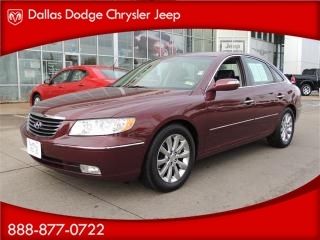 Four door luxury sedan 3.8 liter six cylinder automatic sunroof warranty