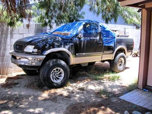 Gently rolled 1997 f-150 lariat, short bed, 4x4, low miles treasure trove!!.