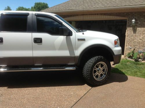 Ford f-150, fx4, supercrew, 4x4, oversized wheels and tires and dvd/cd player!