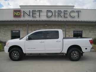 2006 white nissan titan le! 4x4,nav,dvd,
boards,power seats, bed liner.
