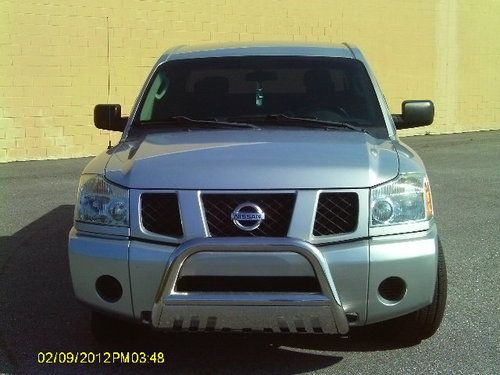 Nissan titan ,4door,am/fm dvd system,bedliner, running boards , chrome bushguard