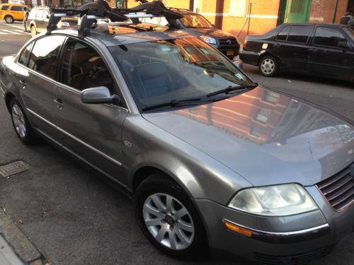 Grey exterior, black leather interior sedan