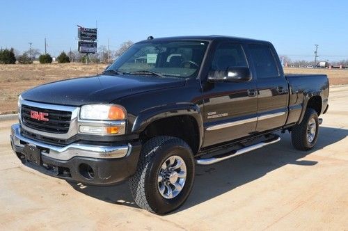 4x4 6.6 duramax diesel -- chrome nerfs -- custom wheels -- dual exhaust -- nice!