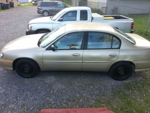 2005 chevrolet classic 4 door sedan - gold - good condition