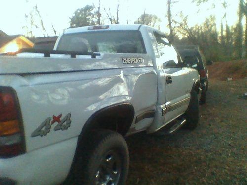 2000chevy silverado.white 4 wheel drive.involved in a rollover.a great deal!!