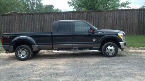 2011 ford f-350 super duty  lariat 4x4 with a fx4 package.
