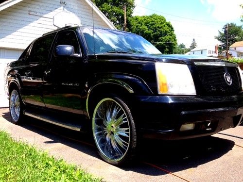 02 cadillac escalade ext 4 door truck. black  26inch wheels