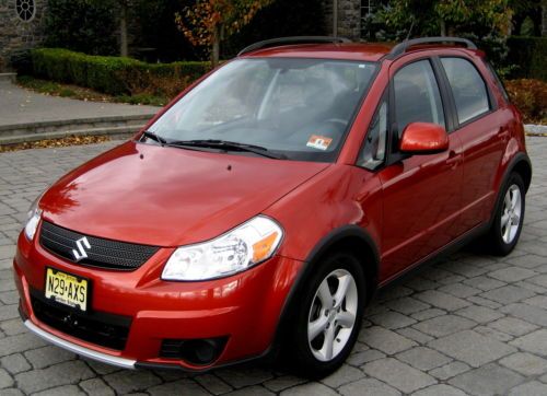 2008 sport awd crossover,red metallic/black cloth,5spd,ac,pw,pdb,58k miles,mint