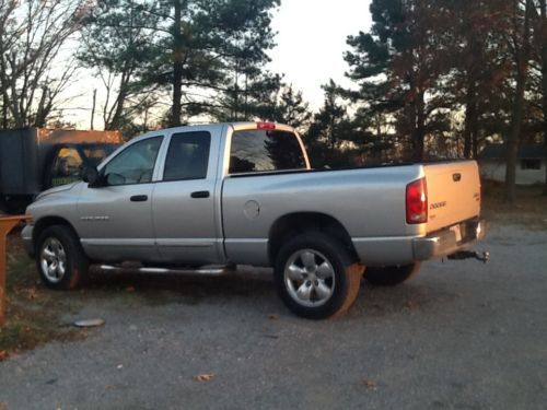 2003 silver dodge ram 1500 hemi very good shape 4 wheel dr leather seats .