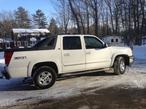 This is a 2005 with under 115,000 miles, white with leather iterior and loaded.