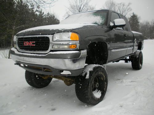 2000 gmc 10" lifted sierra on 37" tires . has straight axles / needs finishing