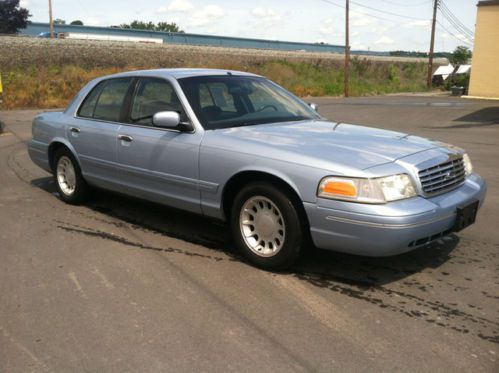 Light blue 4 door sedan blue interior low miles for the year carfax one owner