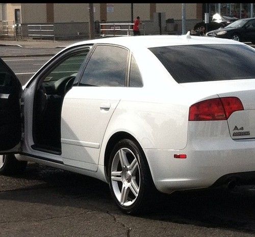 White exterior black leather interior awd 2.0t quattro 4 dr sedan