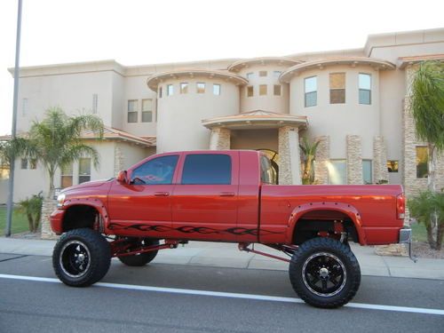 Monster mega cab 4x4 cummins 14" lift 40" toyos dvd 4 jl subs 33k miles