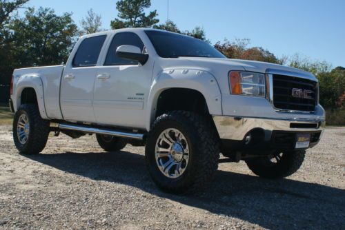 Duramax diesel 4x4 leather 37 inch tires custom rims 6 inch lift bedliner