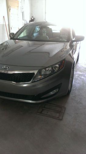 2013 kia opitma with 21,000 miles well kept all higway miles .