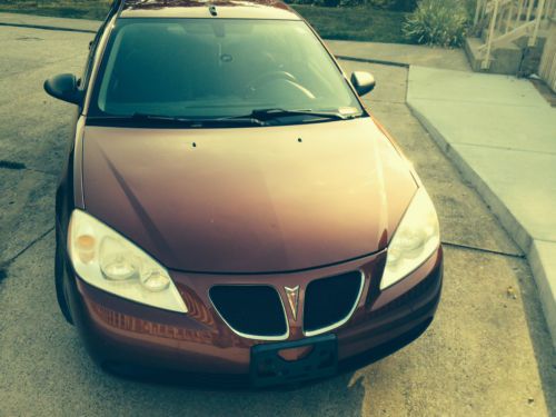 2009 maroon pontiac g6 gt 4 door sedan