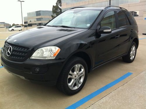 Sport package, approx. 83k miles, black, tan interior, nav, dvd, 18' mb wheels