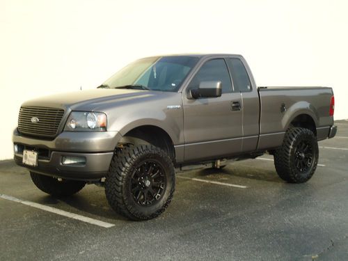 2005 lifted ford stx f150 f-150 35" nitto &amp; 20" kmc blk lthr int. dvd w/extras