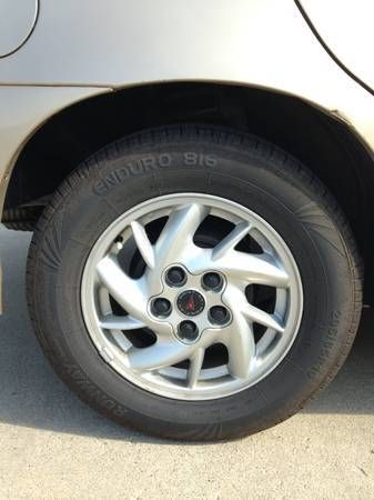 2004 pontiac grand am - gold with spoiler