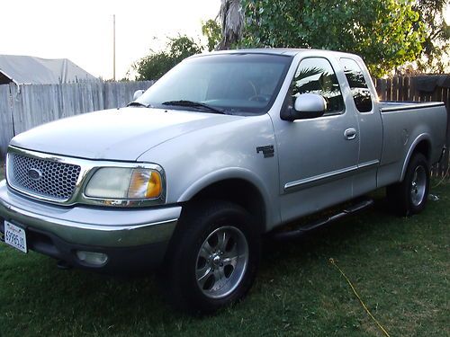 1999 ford f-150 4x4 (80,000 miles on new motor)