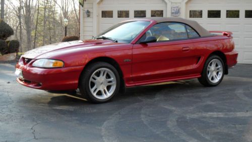 1998 gt convertible tan top/toredor red