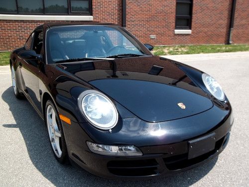 New body style 911 carrera 6 speed, navigation, heated seats, triple black