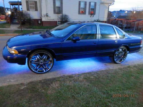 94 impala ss blue/purple with flake and 24&#034; rims....