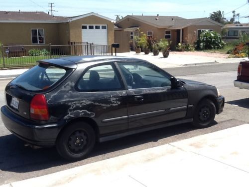 Black honda civic hatchback, runs great,  transmission ok, manual 5 speed