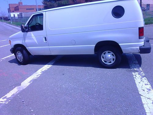 Ford van/truck, e250 white, 8 cylinder, 4 doors enclosed