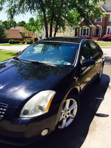 2004 nizzan maxima, black on black, cloth seats. new tires.