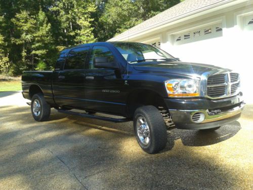 Black 2006 mega cab  4x4 , slt 117,000 miles  5th wheel rails ,brake control