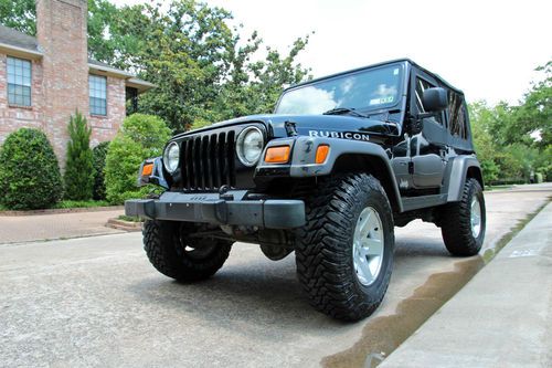 2005 black jeep wrangler 4x4 rubicon with 33" tires - 50k miles