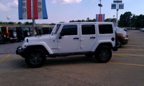 2011 jeep wrangler four door leather 2.5" lift with 35" nitto graplers 29k miles