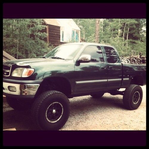 Dark green lifted 2000 toyota tundra sr5 4.7l v8 access cab