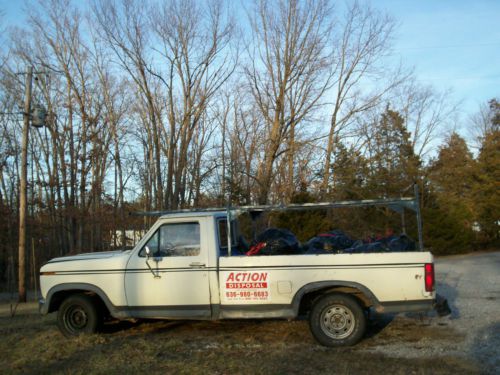 White work  pick-up with ladder rack