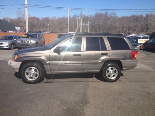 99 jeep grand cherokee 4x4 looks great drives well. tlc special! always serviced