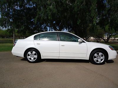 2003 nissan altima -- white -- automatic -- 4 door -- clean --make offer now !!