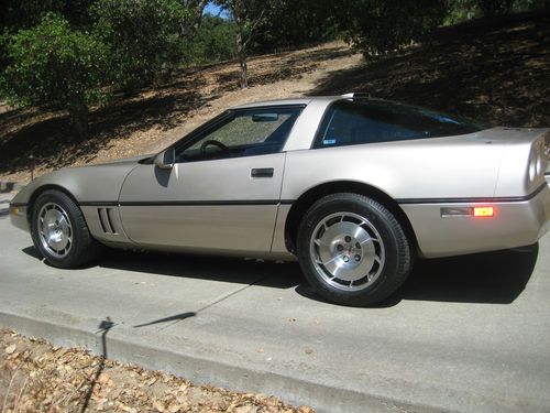 1986 corvette 2-door hatchback, silver beige ext, bronze int.