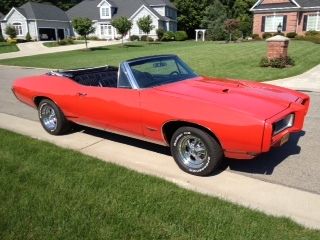 Red convertible, restored, numbers matching, excellent condition