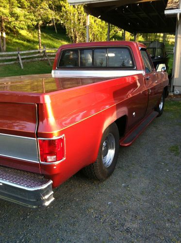 Rust color, tonneau cover, new tires on baby moon rims