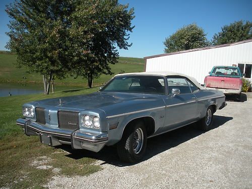 1974 olds 88 royal convertible. medium blue with white convertible top