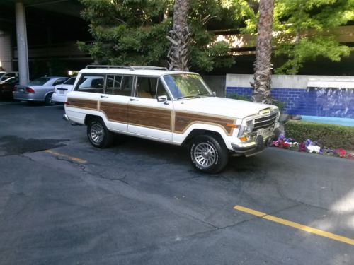 1988 grand cherokee 4x4,white with tan leather,164k,looks and runs great