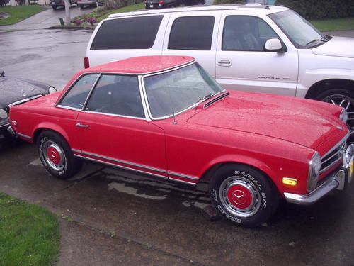 1968 mercedes 280sl  red all original condition no accidents 101k miles 2 owner