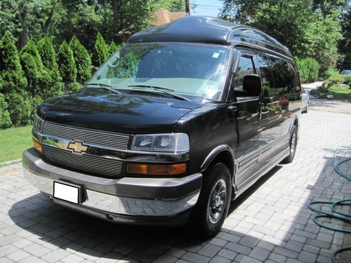 Like new, fully custom, limited edition, 9-passenger, 27" tv, touch screen nav